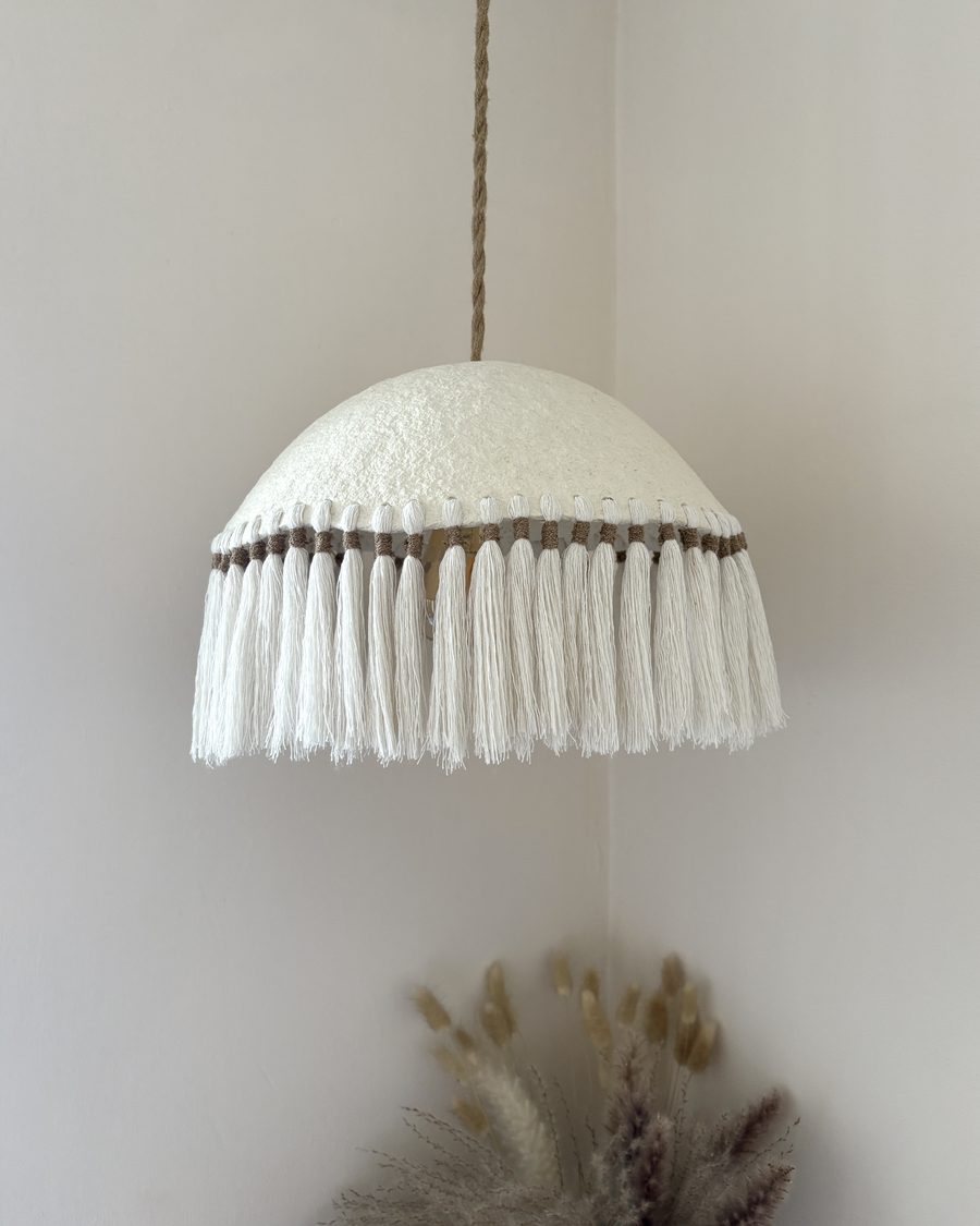 Finished handmade papier-mâché pendant lamp with cotton tassel fringe by Zaré Designs